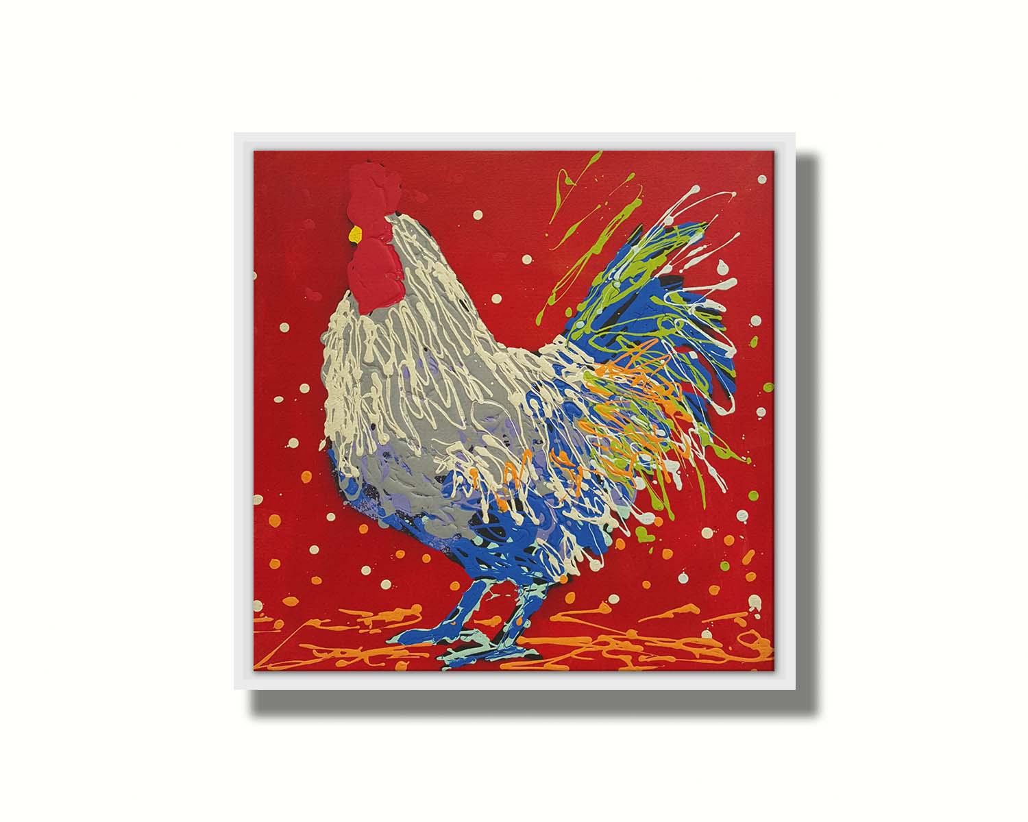 A drip painting of a white, gray, and blue rooster on a red background, accented by yellow and green. Printed on canvas in a float frame.