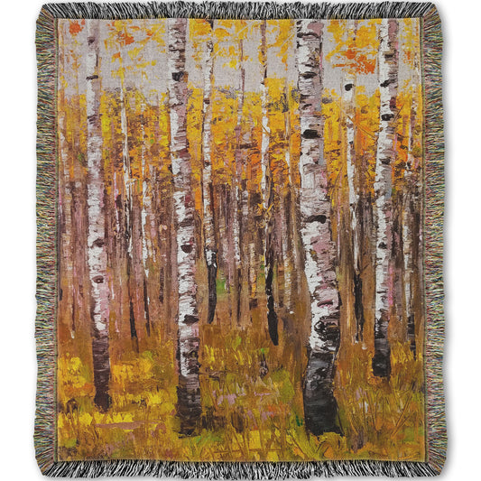 A woven throw blanket designed with a painting of a yellow fall forest of birch trees.