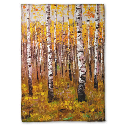 A fleece throw blanket designed with a painting of a yellow fall forest of birch trees.