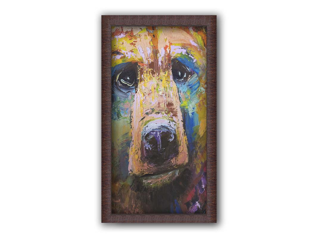 A painting of a bear's face closeup, accented with blue and yellow. Printed on canvas and framed.