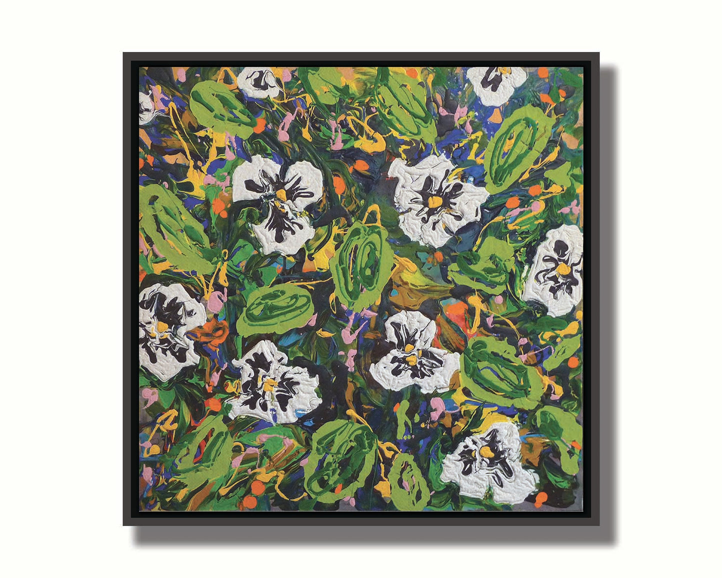 A painting of a top down drip painting view of white pansy flowers. Printed on canvas and framed.