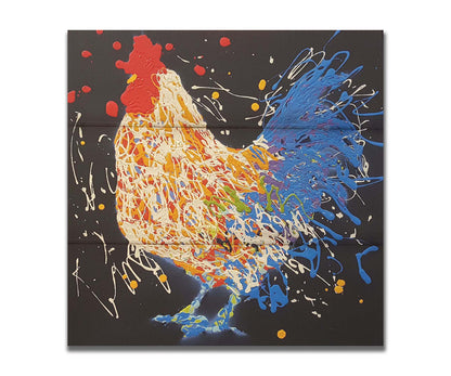 A drip painting of a white and blue rooster on a black background, accented with yellow, red, purple, and green. Printed on a box board.