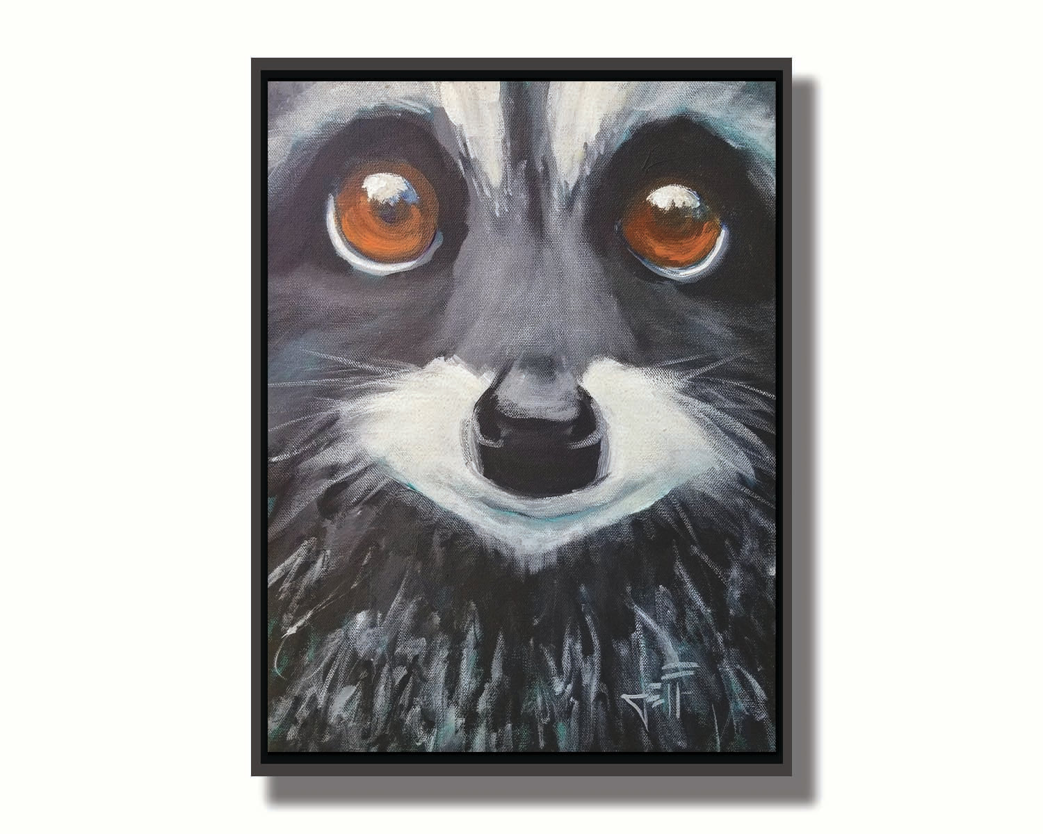 A close up painting of a raccoon's face, with big brown eyes. Printed on canvas in a float frame.