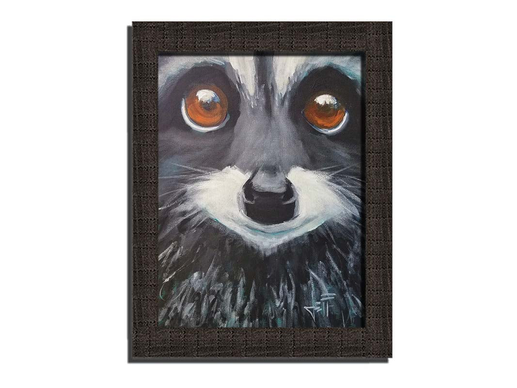 A close up painting of a raccoon's face, with big brown eyes. Printed on canvas and framed.