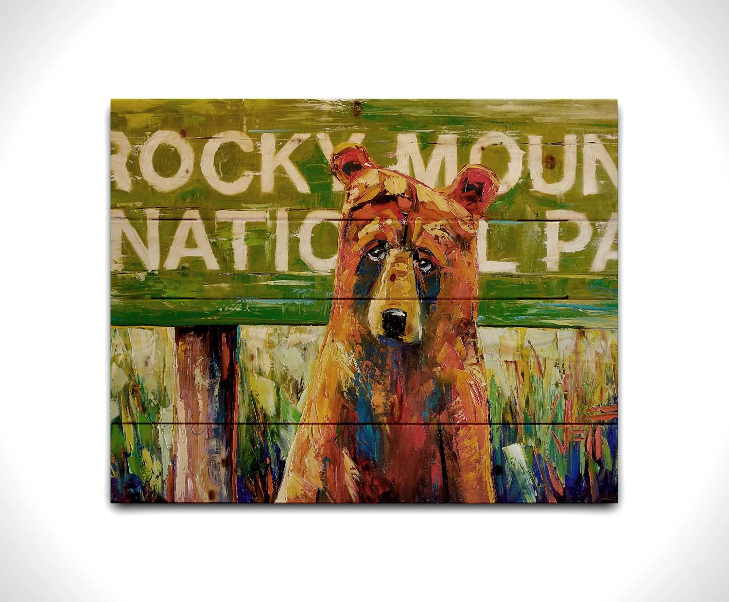 A painting of a bear standing in front of a "Rocky Mountain National Park" sign. Printed on a wood pallet.