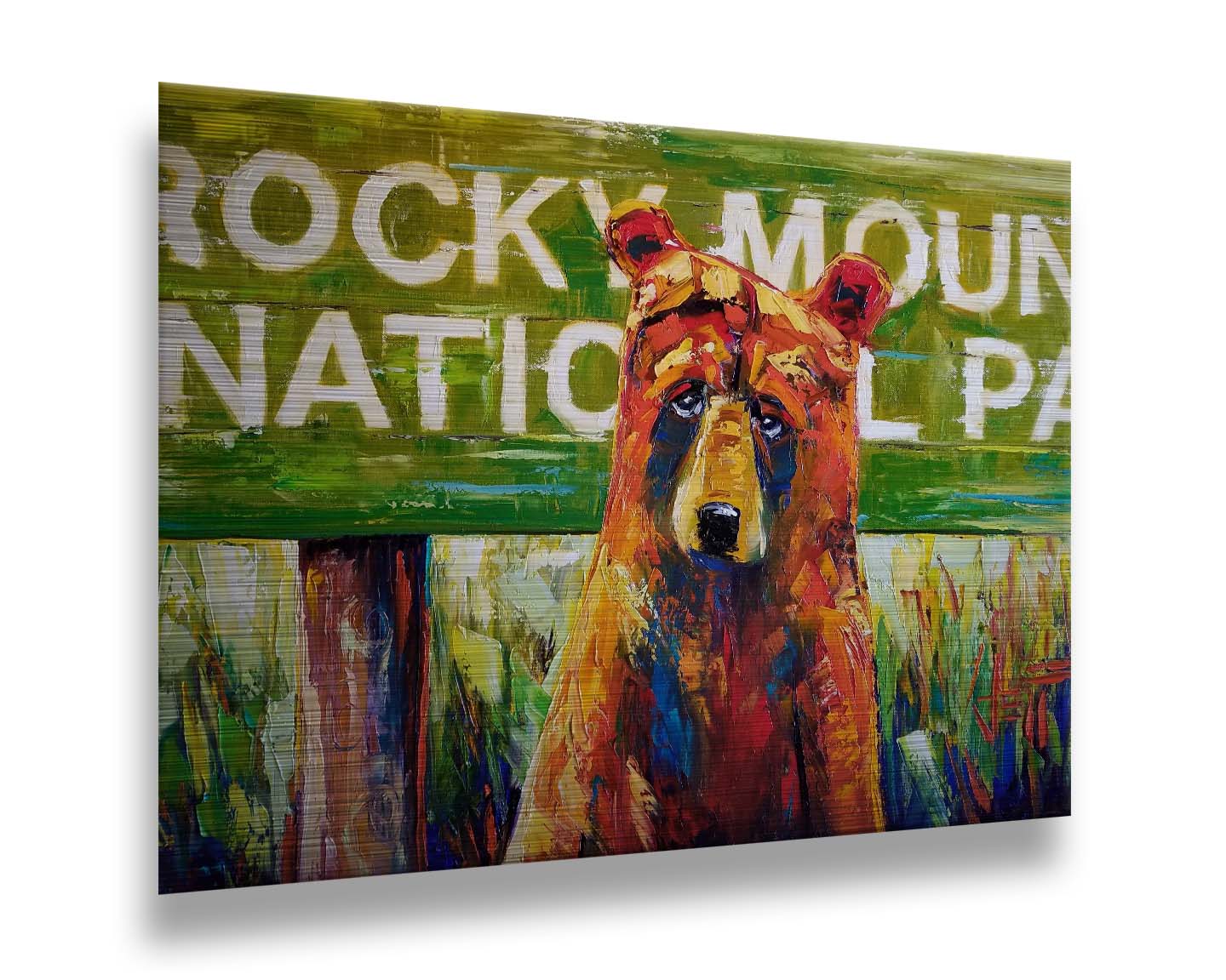 A painting of a bear standing in front of a "Rocky Mountain National Park" sign. Printed on metal.