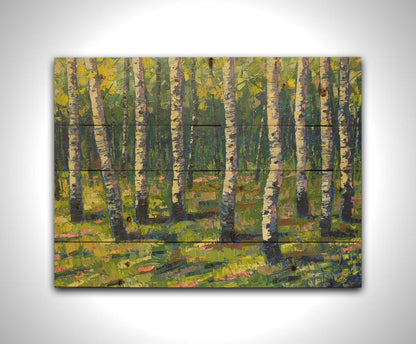 A painting of a bright green forest of birch trees with stark white trunks, accented with blue. Printed on a wood pallet.