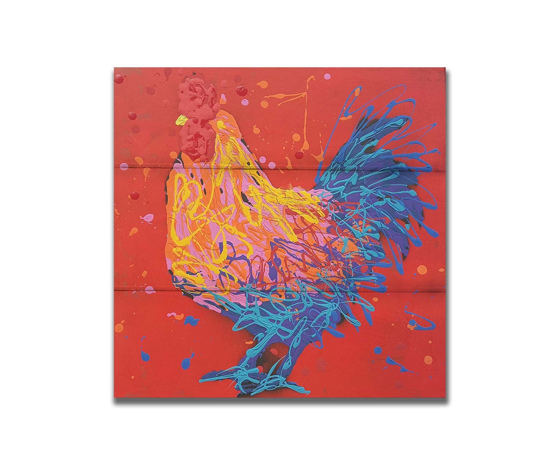 A drip painting of a blue, pink, and yellow rooster on a bright red background. Printed on a box board.