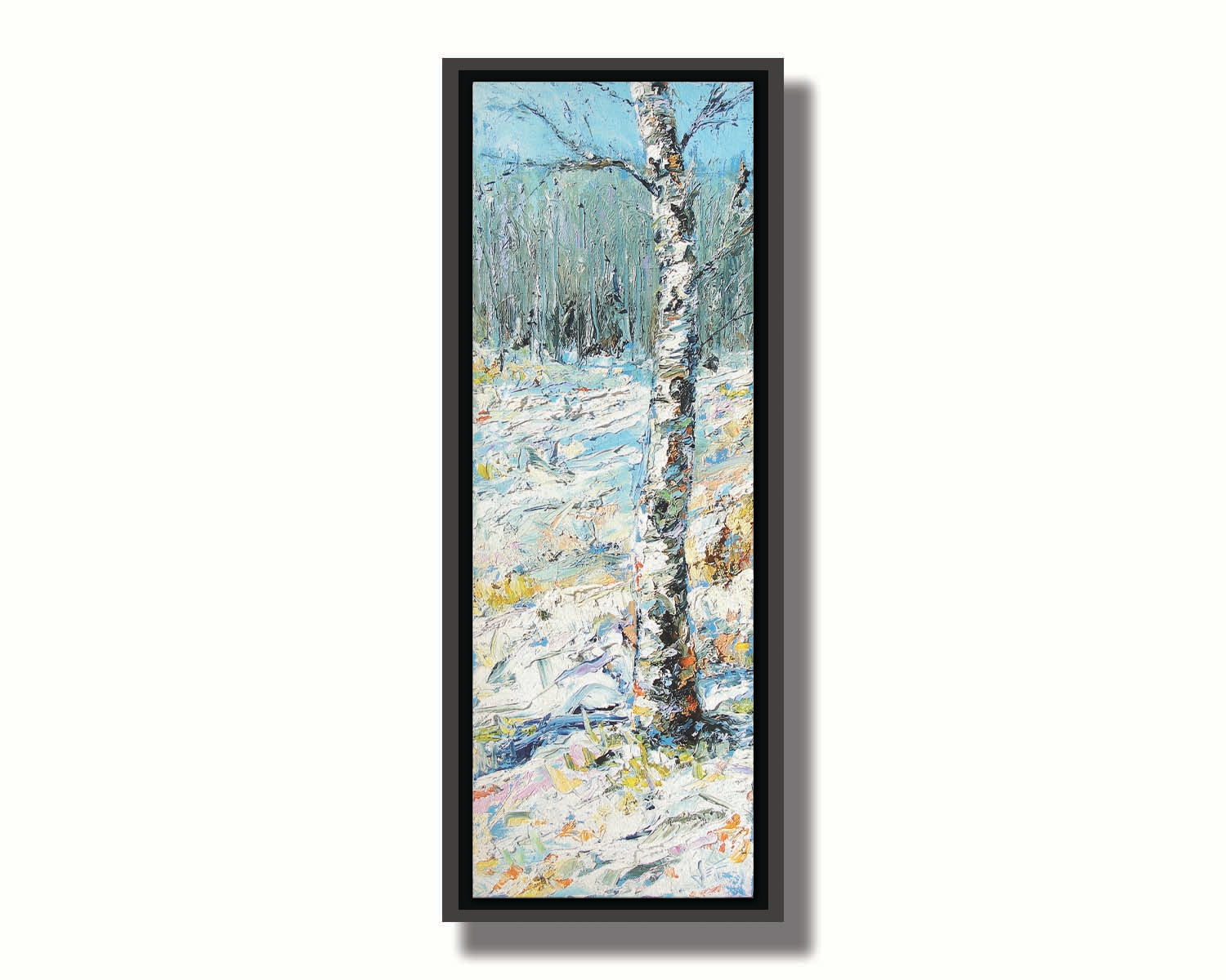 An expressive painting of a birch tree in the snow, far from the rest of the grove on the horizon. Printed on canvas in a float frame.