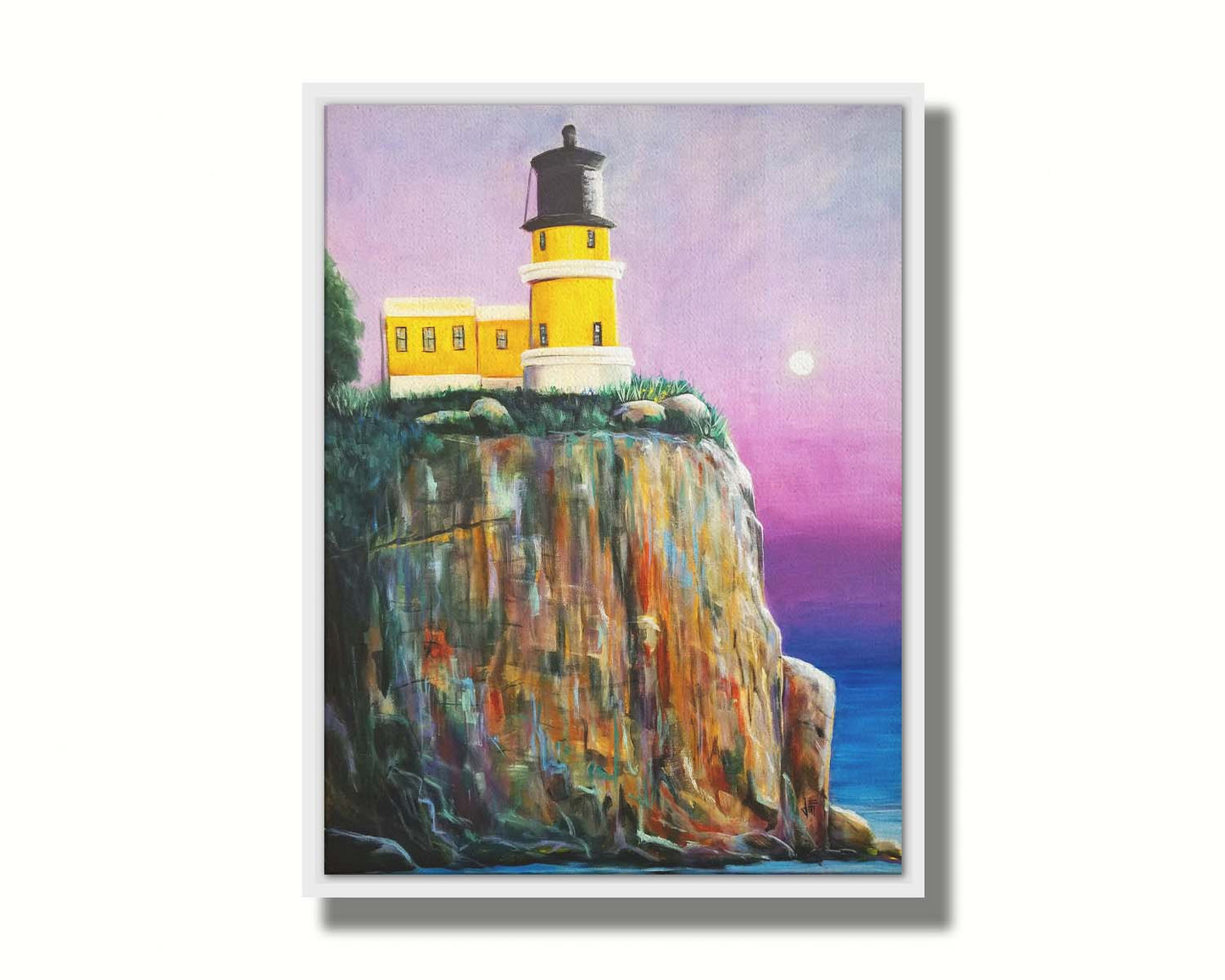 A painting of a bright yellow lighthouse perched on a cliff face above a vibrant blue sea, with a pink and purple sky. Printed on canvas in a float frame.