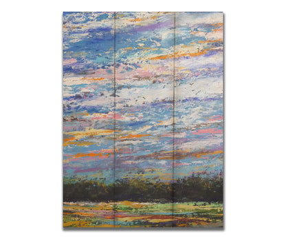 A colorful painting of the sky, using heavily textured applications of paint. Printed on a box board.