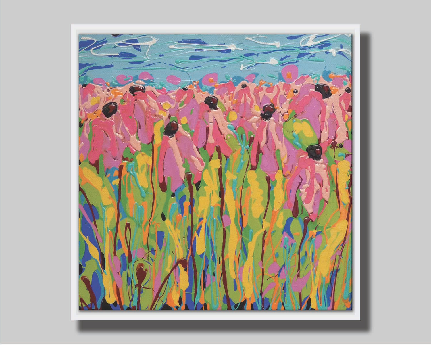 A drip painting of a field of pink wildflowers against a blue background. Printed on canvas in a float frame.