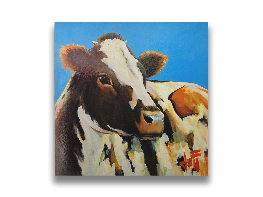 A painting of a cow basking in the sun against a bright blue background. Printed on canvas.