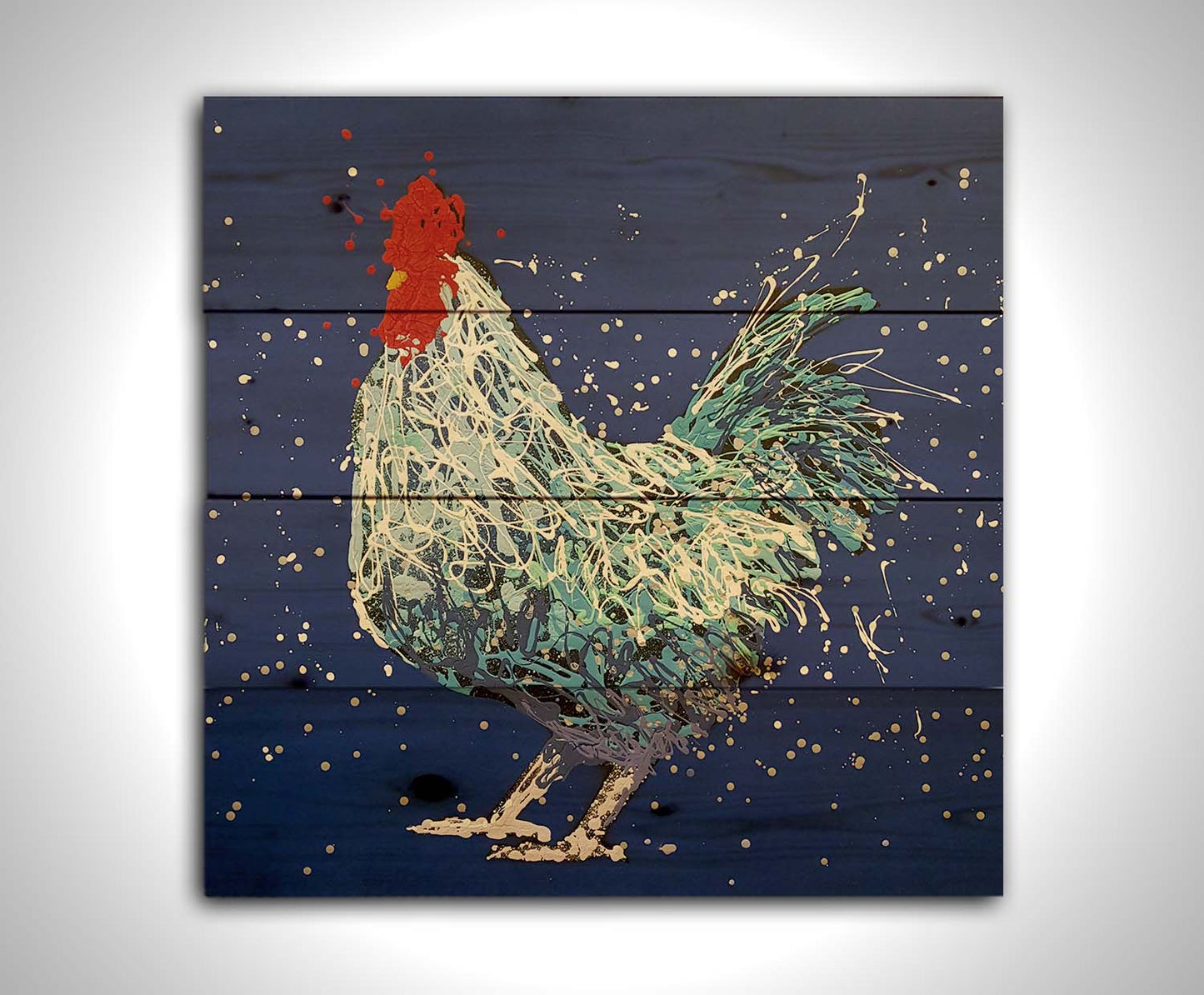 A drip painting of a white and blue rooster on a vibrant blue background. Printed on a wood pallet.