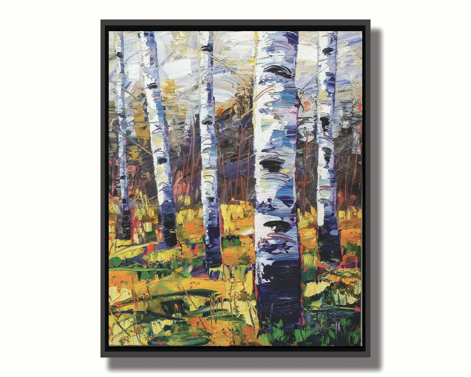 A painting of a birch forest, with vibrant grasses and foliage contrasing the black and white birch trunks. Printed on canvas in a float frame.