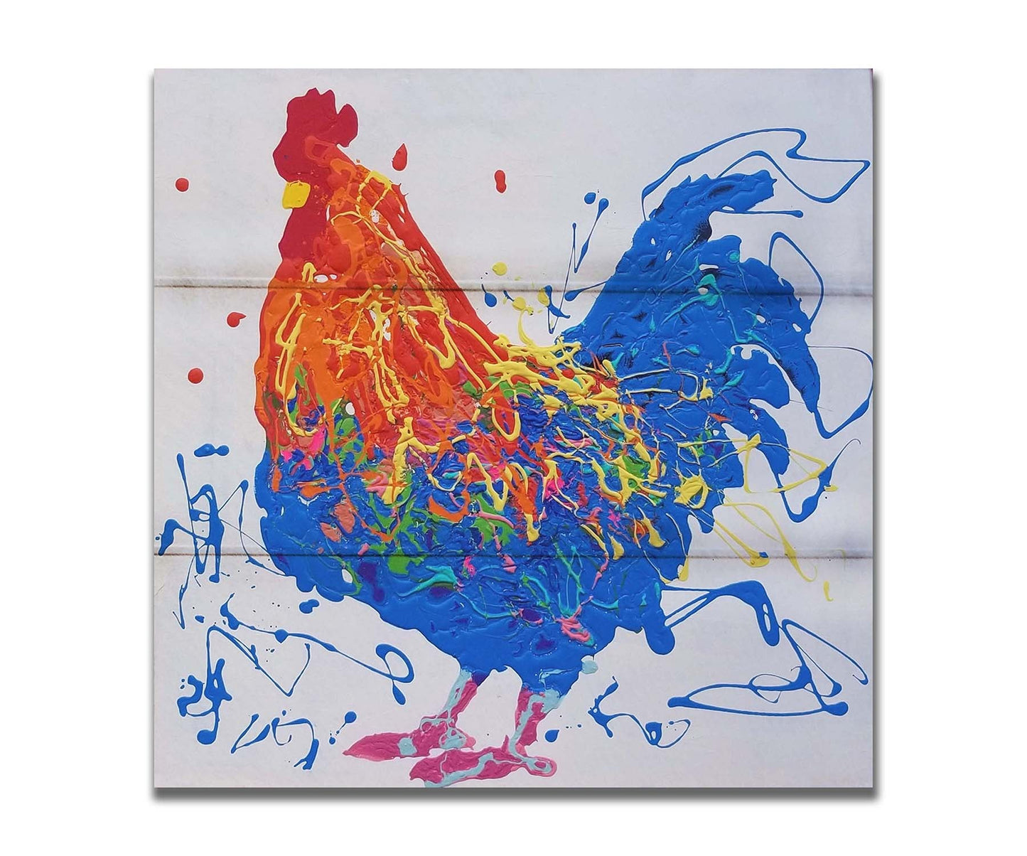 A drip painting of an orange and blue rooster on a white background, accented by yellow, green, red, and purple. Printed on a box board.