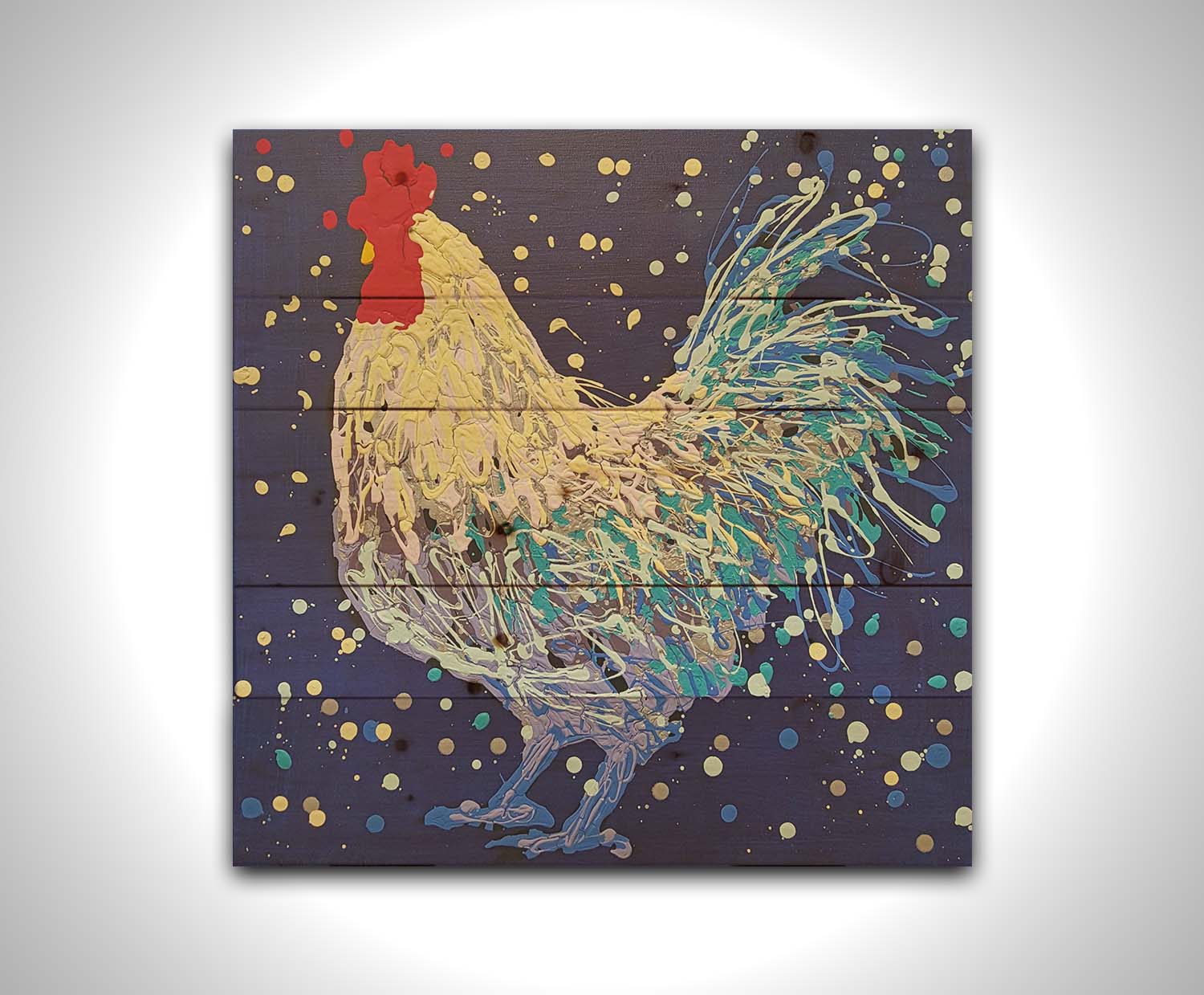 A drip painting of a white and blue rooster on a navy blue background, accented by red and gray. Printed on a wood pallet.