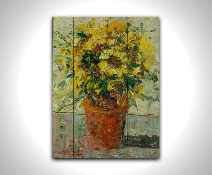 An expressive painting of an orange clay pot full of yellow sunflowers. Printed on a wood pallet.