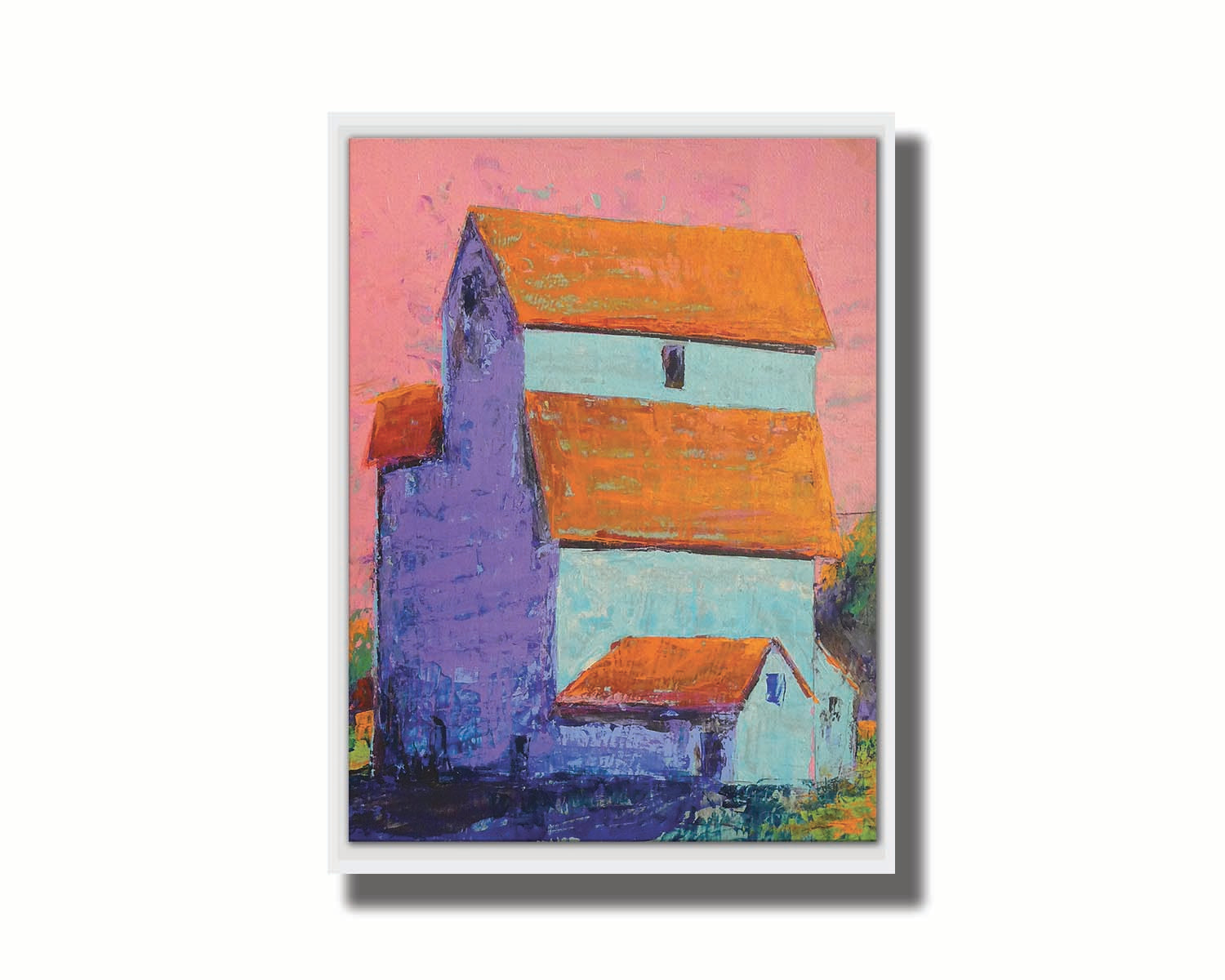 A painting of a tall white farm building with orange roofs against a pink sky. Printed on canvas in a float frame.