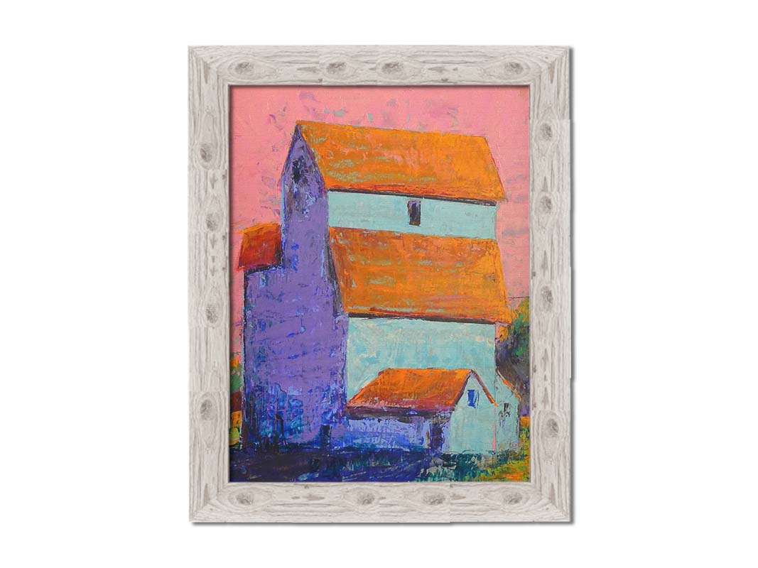 A painting of a tall white farm building with orange roofs against a pink sky. Printed on canvas and framed.