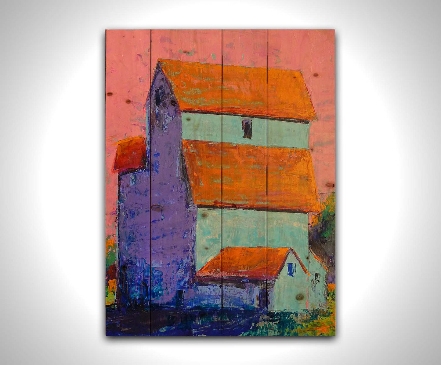 A painting of a tall white farm building with orange roofs against a pink sky. Printed on a wood pallet.