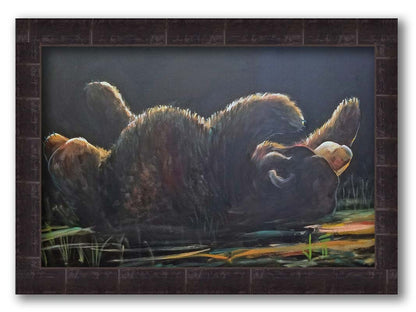 A painting of a bear rolling onto its back, with a dark background. Printed on canvas and framed.