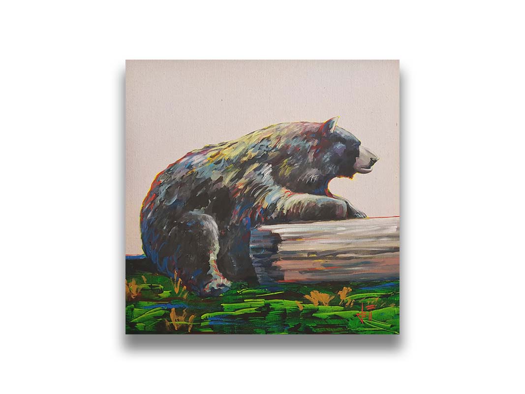 A painting of a bear accented with red, yellow, and blue sitting against a log on bright green grass with a pale pink background. Printed on canvas.