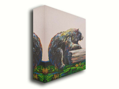 A painting of a bear accented with red, yellow, and blue sitting against a log on bright green grass with a pale pink background. Printed on canvas.