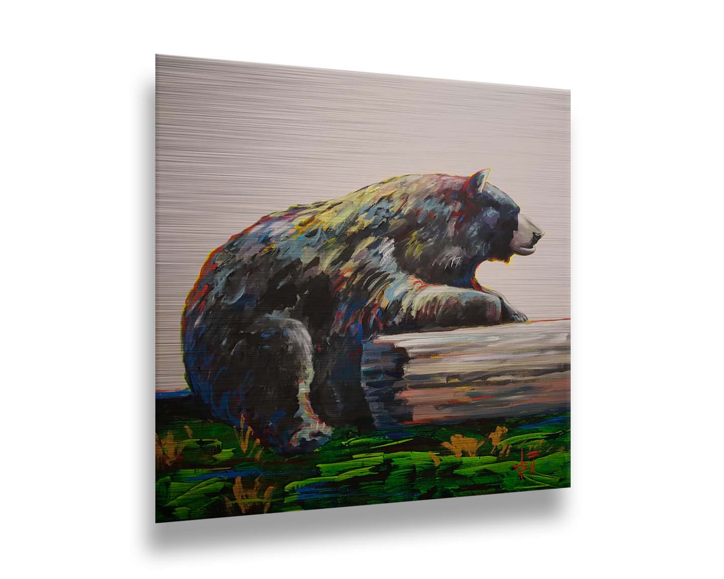 A painting of a bear accented with red, yellow, and blue sitting against a log on bright green grass with a pale pink background. Printed on metal.