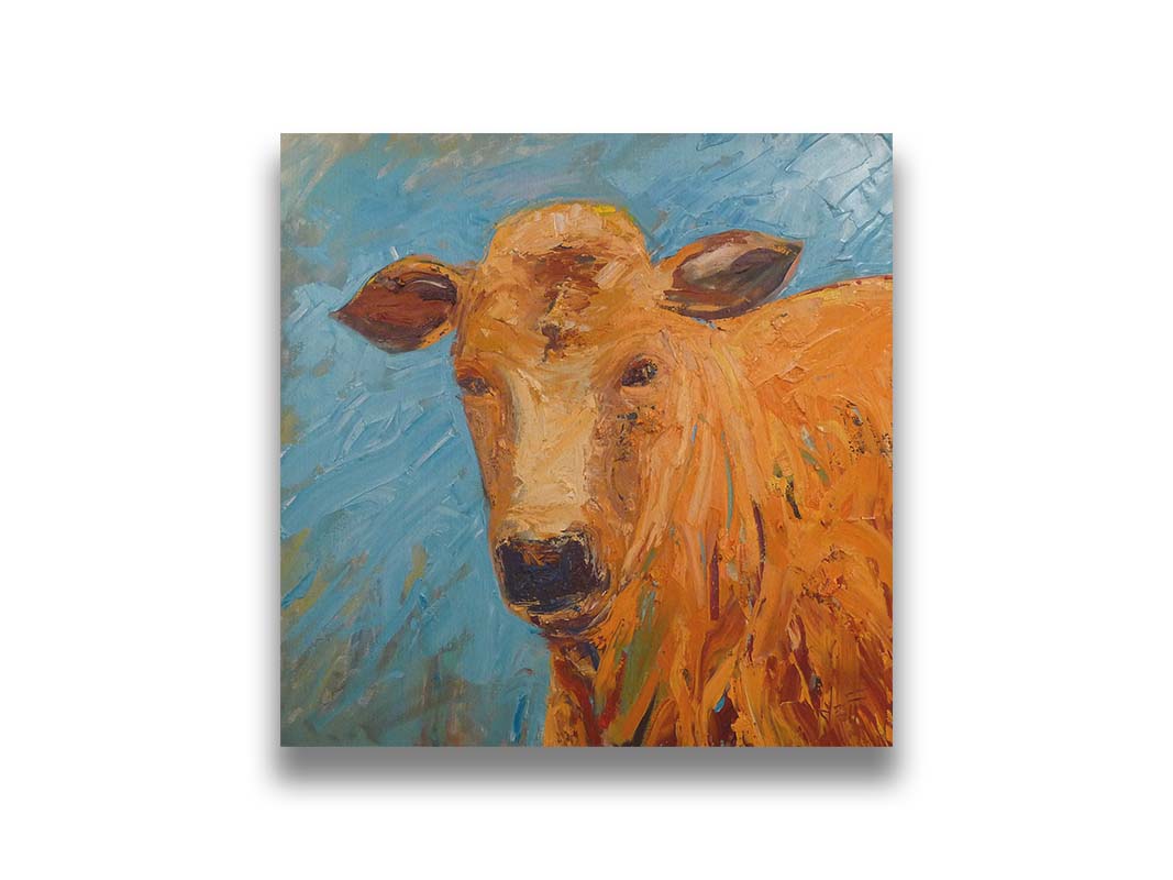 An expressive painting of an orange-brown cow's face against a blue background. Printed on canvas.