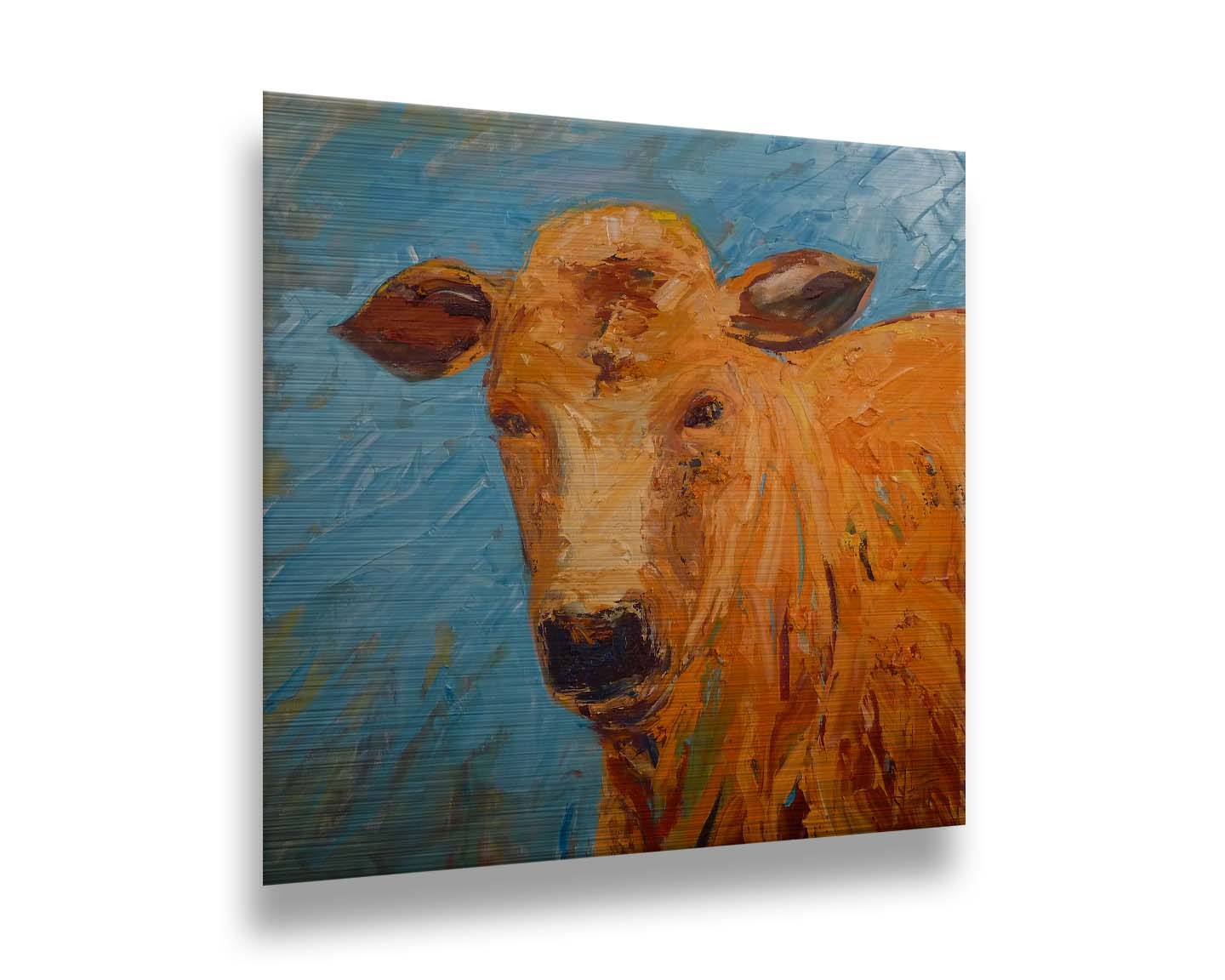 An expressive painting of an orange-brown cow's face against a blue background. Printed on metal.