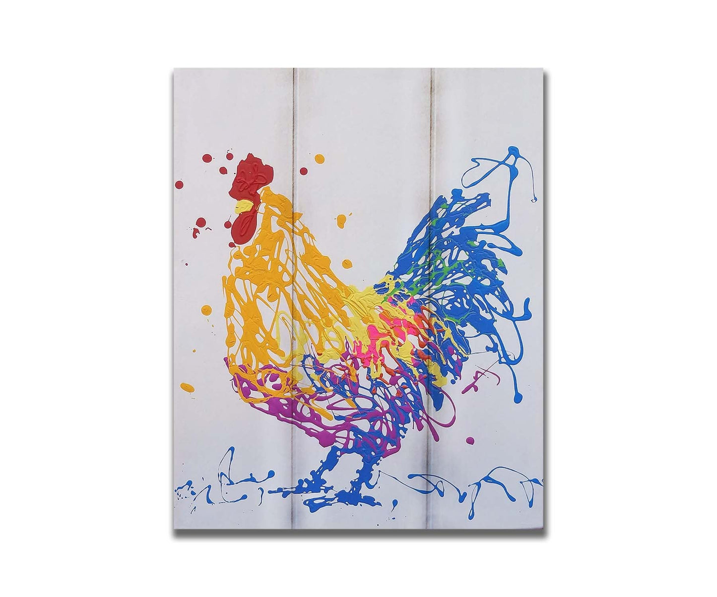 A drip painting of a brightly colored yellow and blue rooster, accented with red, pink, green, and purple. Printed on a box board.