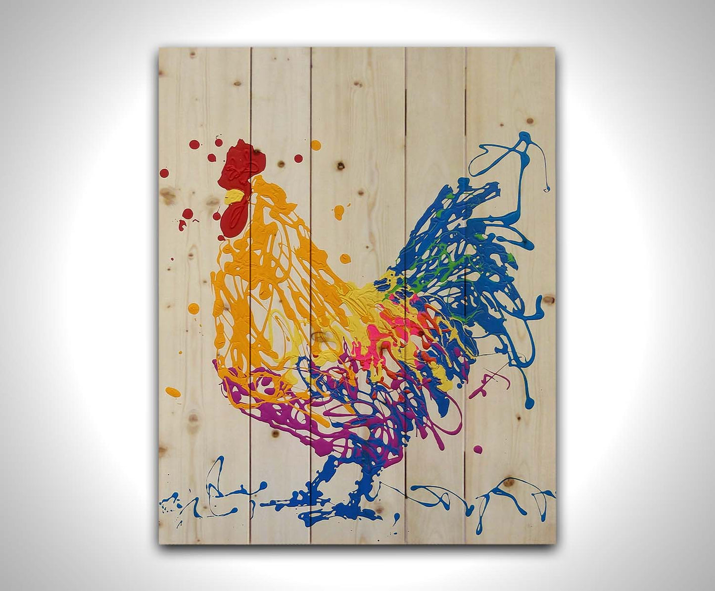 A drip painting of a brightly colored yellow and blue rooster, accented with red, pink, green, and purple. Printed on a wood pallet.