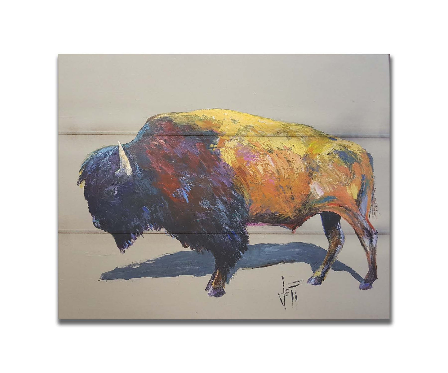 A painting of a bison on a gray background. The bison is highly textured with visible brushstrokes, with accents of contrasting arbitrary colors. Printed on a box board.