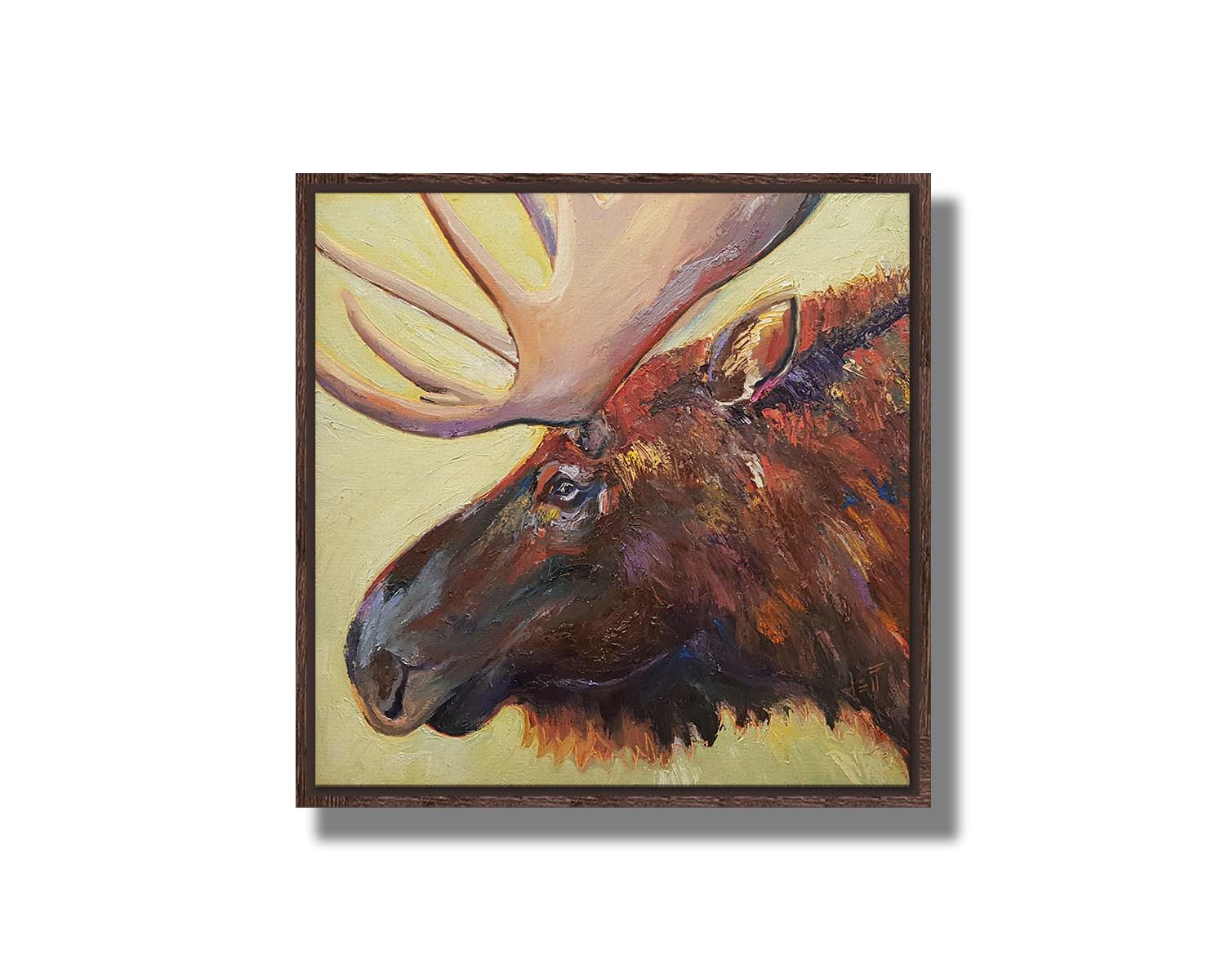 An expressive painting of a moose's face against a pale yellow background. Printed on canvas in a float frame.