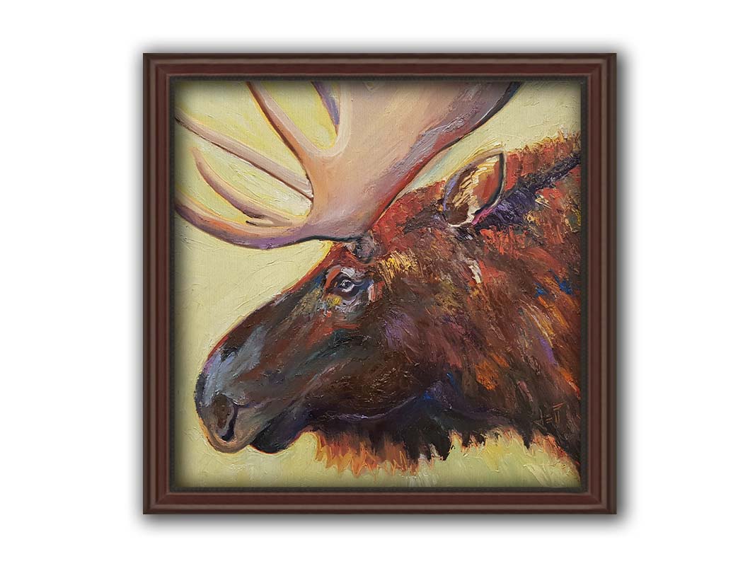 An expressive painting of a moose's face against a pale yellow background. Printed on canvas and framed.