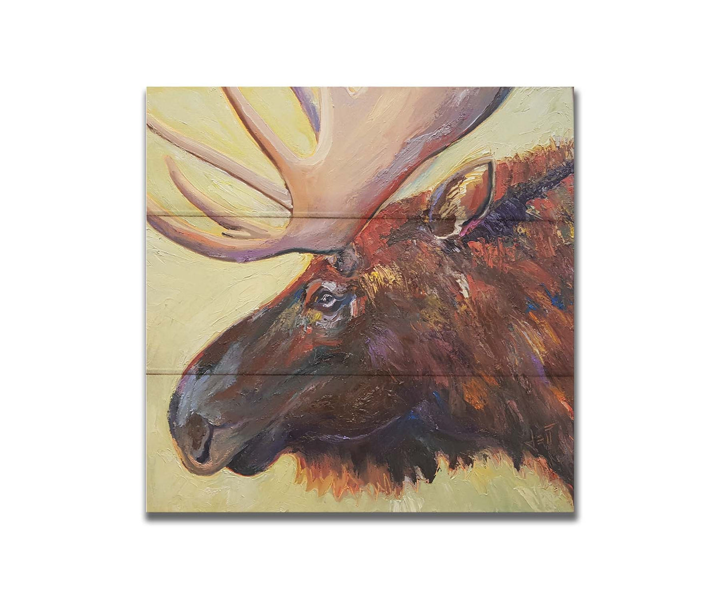 An expressive painting of a moose's face against a pale yellow background. Printed on a box board.