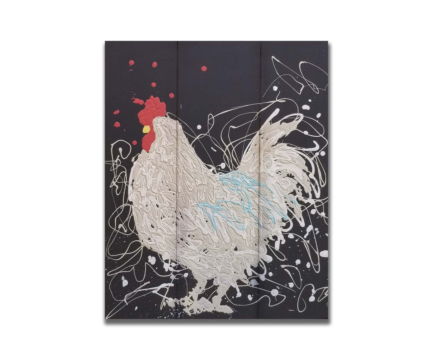 A drip painting of a white rooster on a black background, accented with blue, red, and yellow. Printed on a box board.