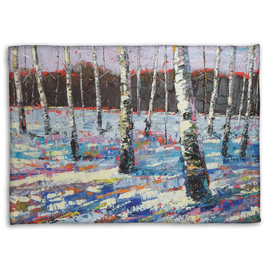 Coral fleece blanket printed with an abstract painting of birch trees in a snowy landscape.
