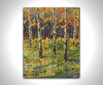 A painting of a birch forest in autumn, the yellow and orange tree leaves contrasted against a purple and blue forest and sky. Printed on a wood pallet.