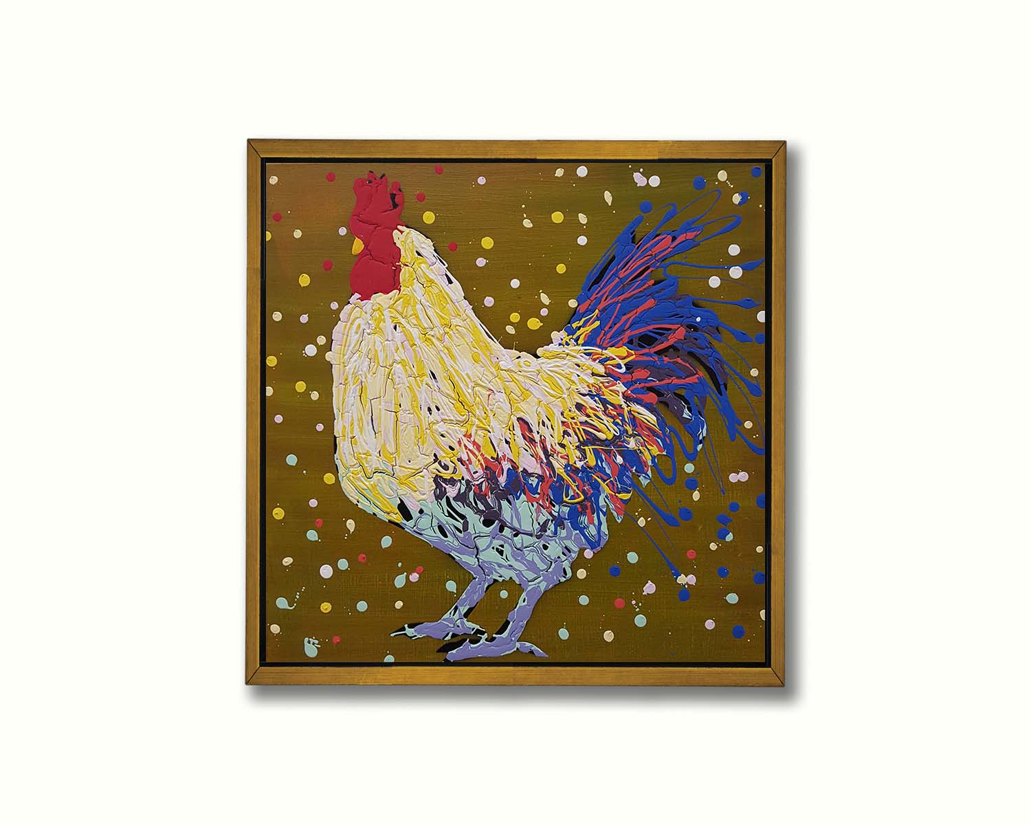 A drip painting of a rooster in white, yellow, and blue, with red accents It is posed on a gold background dotted with the colors of the rooster. Printed on canvas in a float frame.