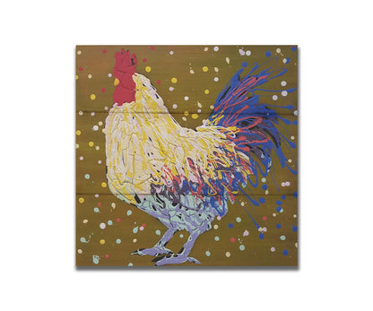 A drip painting of a rooster in white, yellow, and blue, with red accents It is posed on a gold background dotted with the colors of the rooster. Printed on a box board.