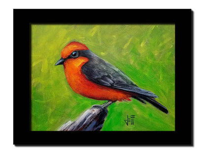 A painting of a vermilion flycatcher bird, with red and black feathers, perched on a piece of wood before a green background. Printed on canvas and framed.