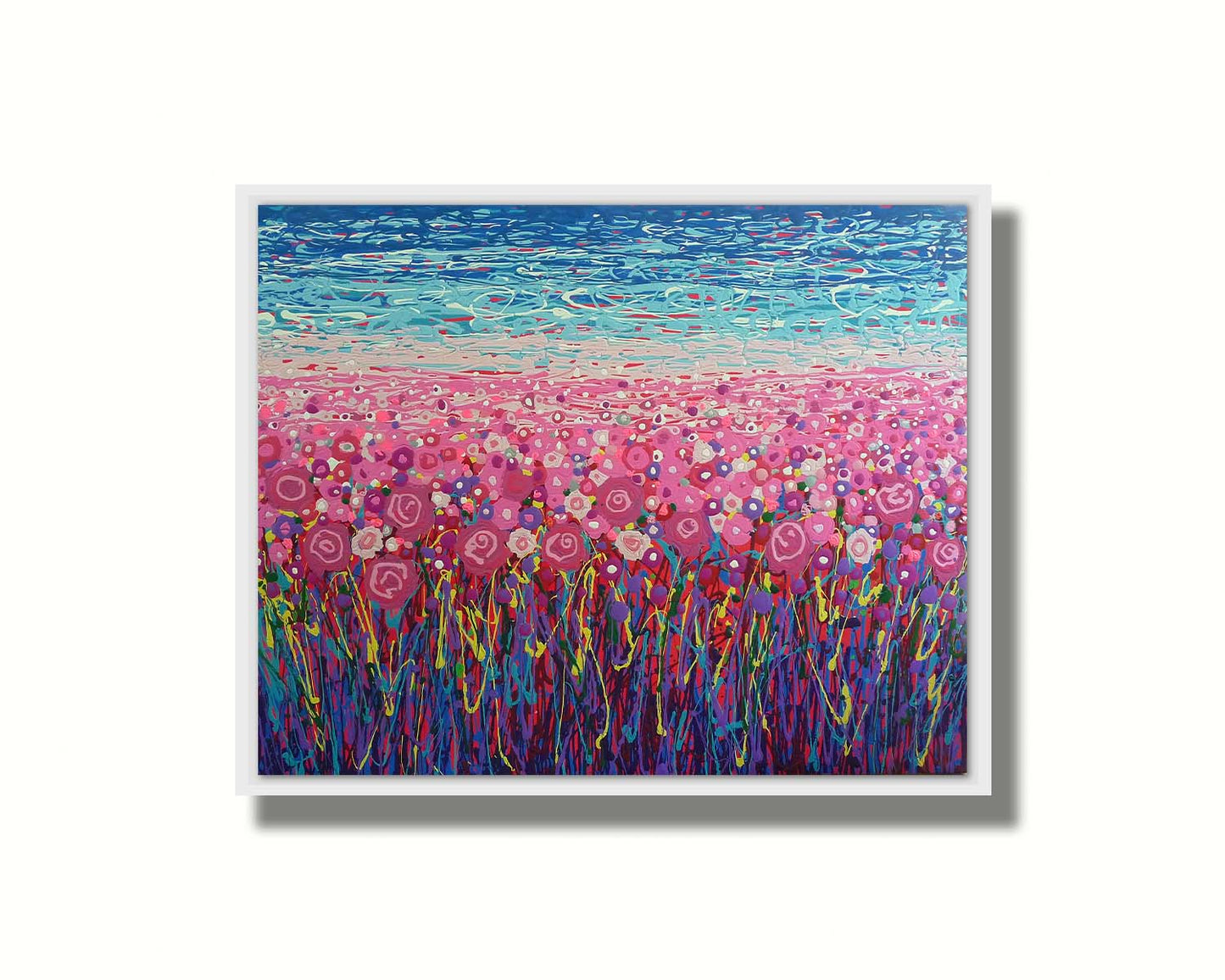 A drip painting of a field of pink and purple flowers, accented with red, yellow, green, and white. Printed on canvas in a float frame.