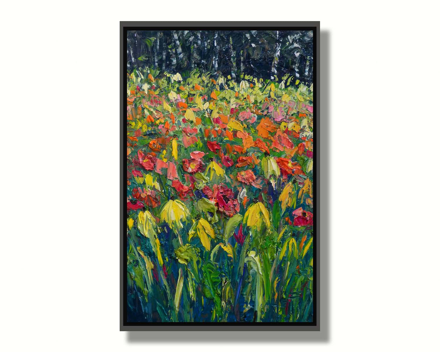 A painting of red, orange, and yellow flowers, including yellow cornflowers. The warm petal colors are contrasted by the vibrant green stems and the dark birch forest in the background. Printed on canvas in a float frame.