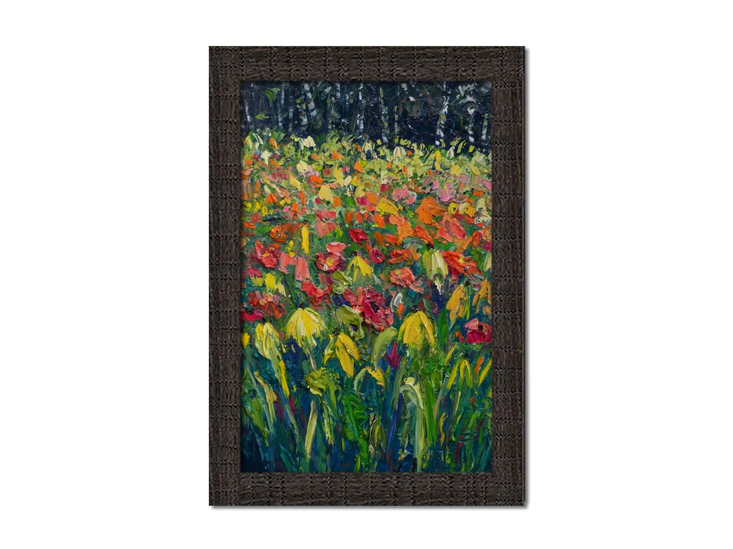 A painting of red, orange, and yellow flowers, including yellow cornflowers. The warm petal colors are contrasted by the vibrant green stems and the dark birch forest in the background. Printed on canvas and framed.