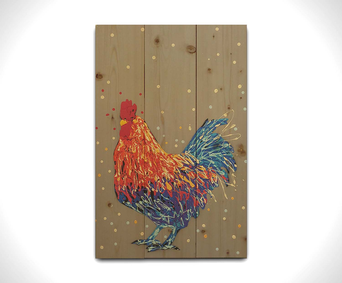 A drip painting of a red and blue rooster against a warm gray background. Printed on a wood pallet.