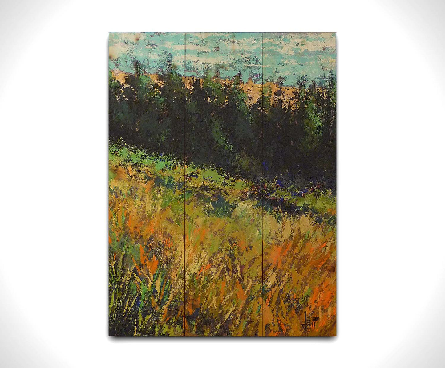 A painting of a grassy green and orange hill, lined in the distance by evergreen trees. Printed on a wood pallet.