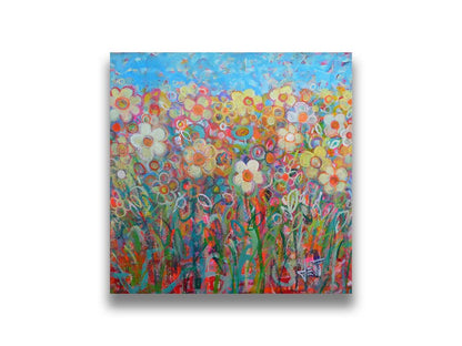 A painting of a simplified field of flowers in a variety of colors, set against a bright blue sky. Printed on canvas.