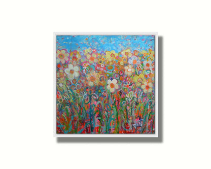 A painting of a simplified field of flowers in a variety of colors, set against a bright blue sky. Printed on canvas in a float frame.